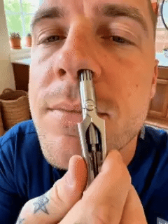 Manual nose hair trimmer demonstration GIF Manual nose hair trimmer demonstration GIF