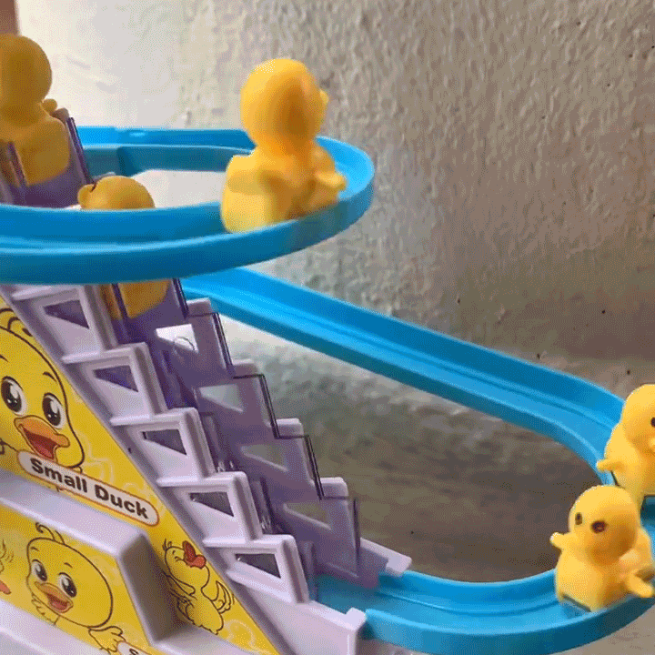Animated close-up of ducks moving along the blue track